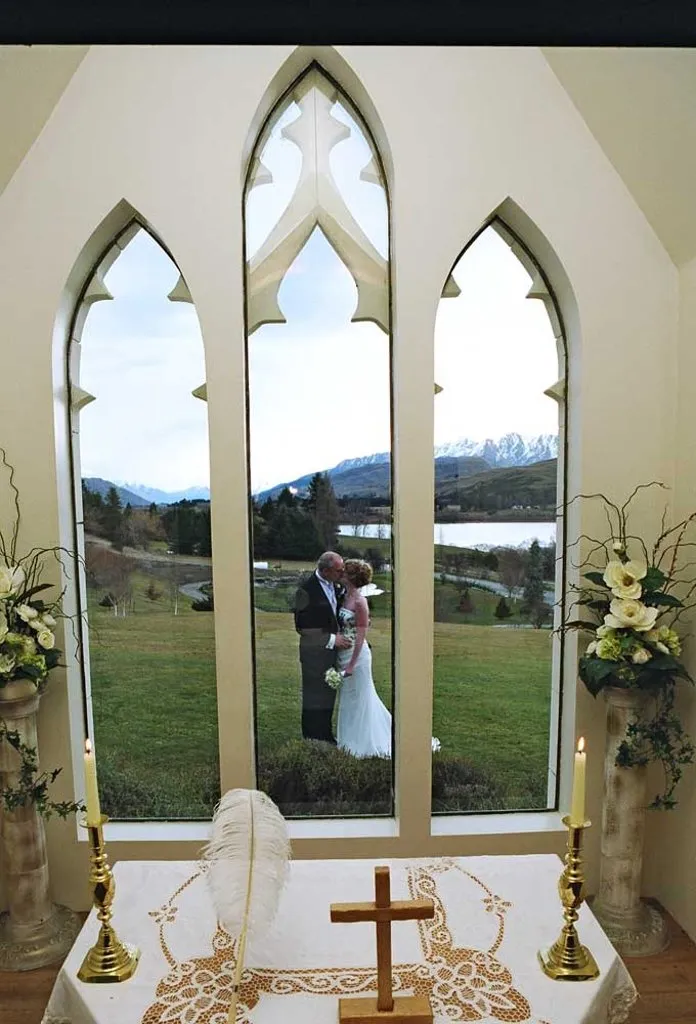 The chapel altar with Gothic windows overlooking Lake Hayes and the mountains at Stoneridge Estate