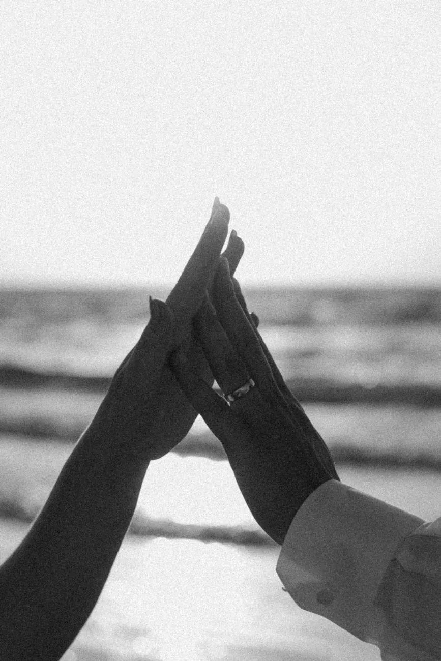 Hands with a ring Two hands pressed together showing a wedding ring, black and white
