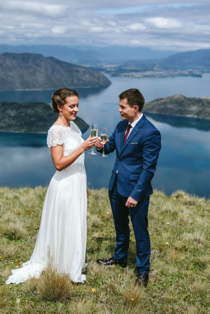 Bride and groom toast their union atop Lookout Hill, Wanaka