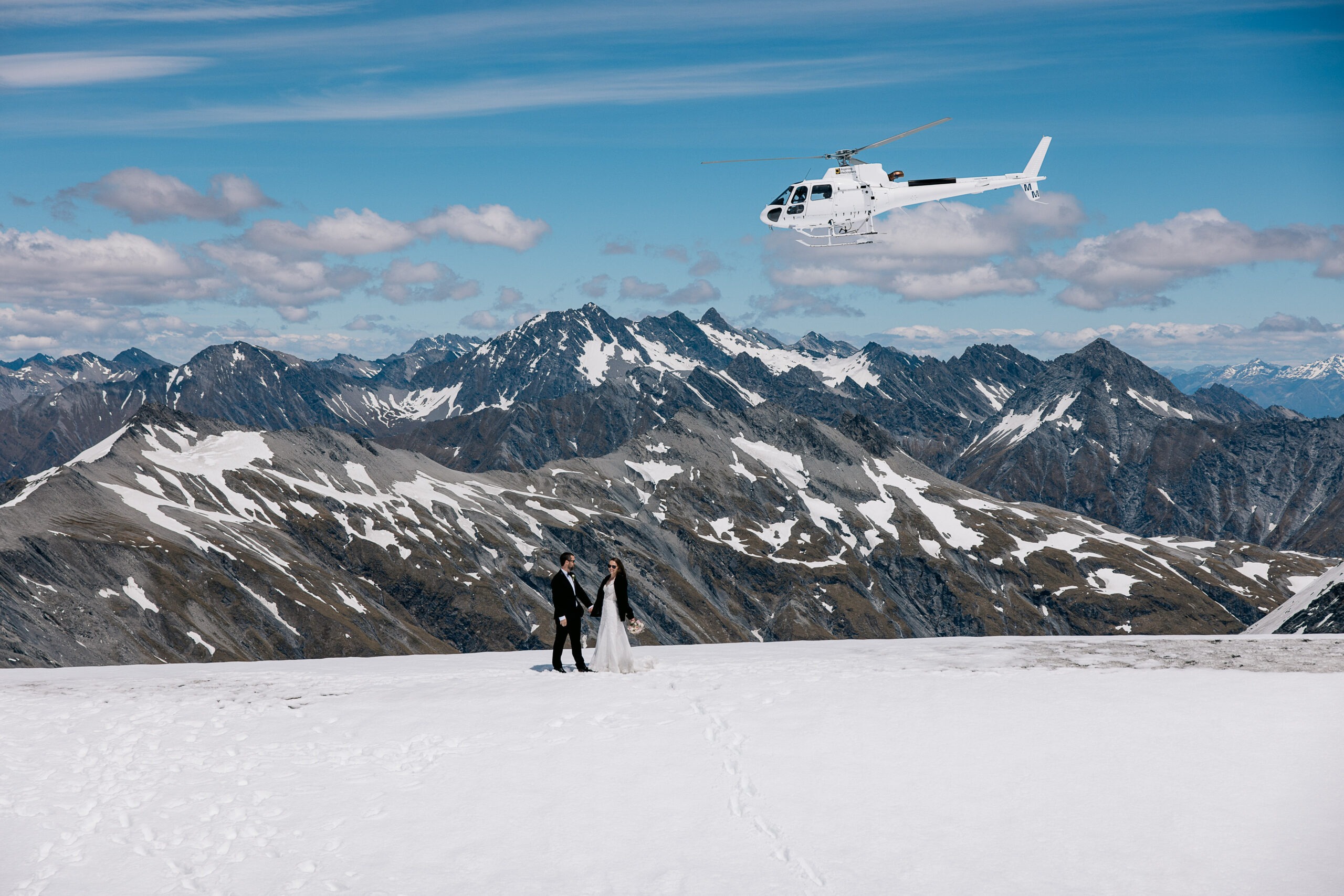 Helicopter elopement on New Zealand alpine conservation land requiring DOC concession and professional wedding planning