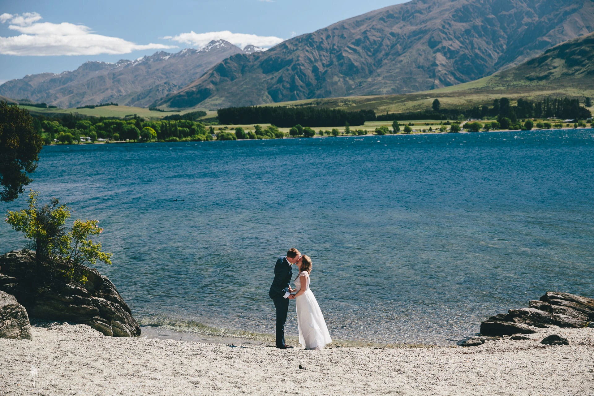 Lakeside wedding ceremony beside Lake Wanaka with mountain views, New Zealand