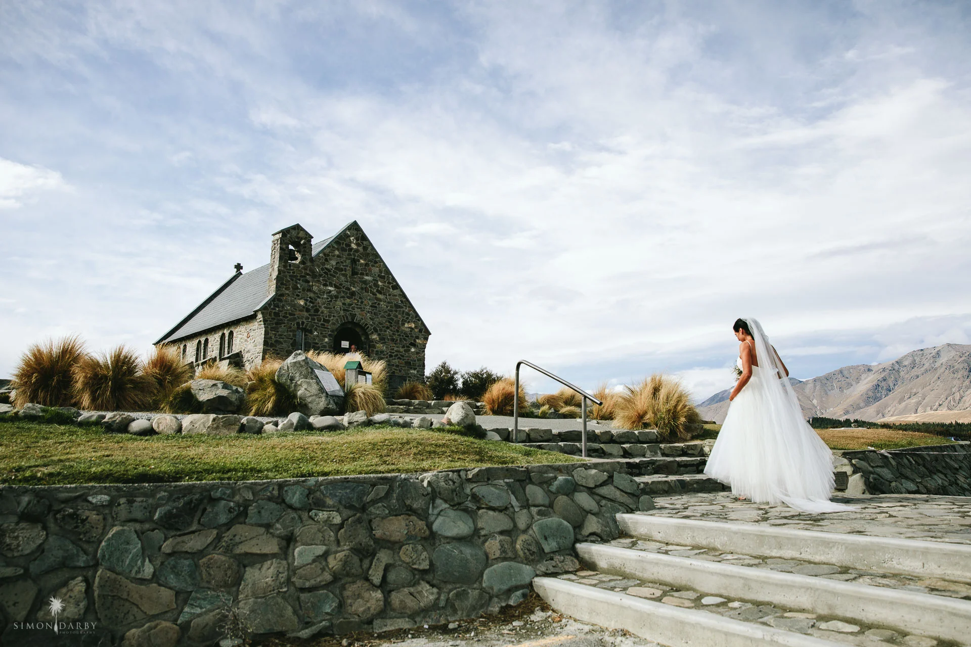 Bride arriving at the Church of the Good Shepherd in Lake Tekapo for her New Zealand elopement